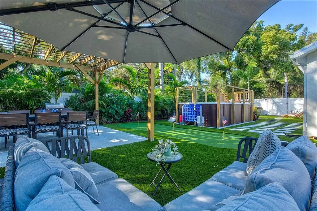 Pergola lounge, lawn games, and putting green